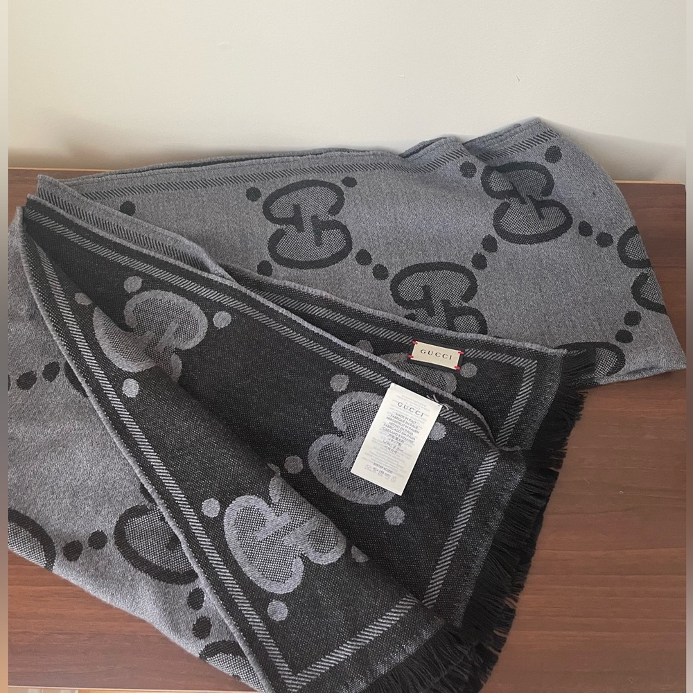 100% Wool GG monogram scarf, contrasting grey and black with a fringe trim.